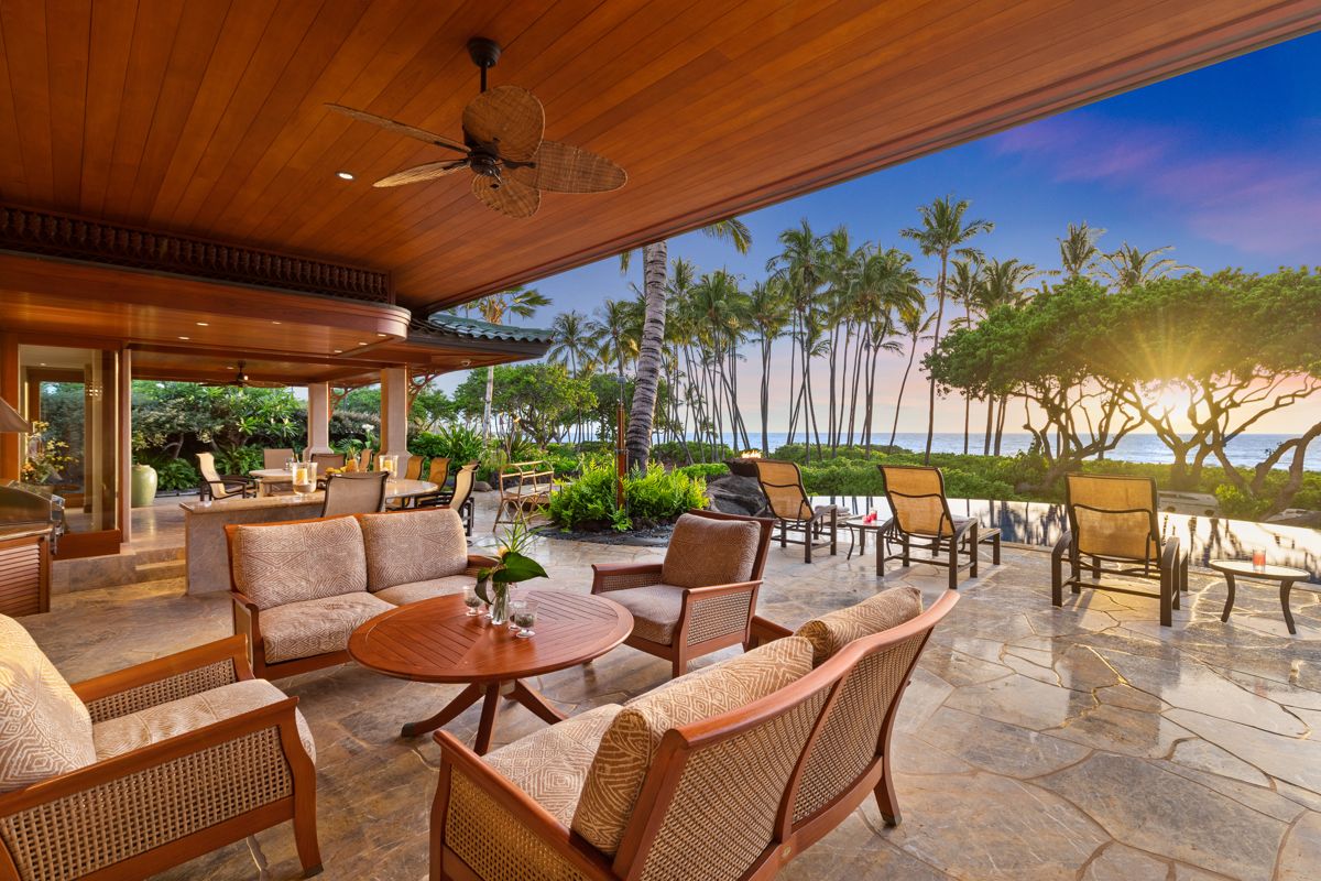 Covered lanai overlooking palms and the Pacific
